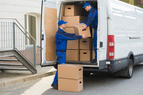 Moving vehicle near period homes and flats in Belsizepark