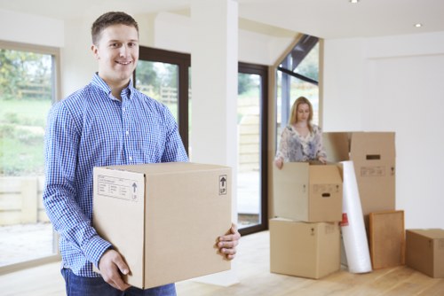 Packed moving boxes and furniture prepared for transport in a Belsize Park flat