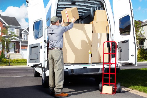 Careful loading of household items for a move near Belsize Park