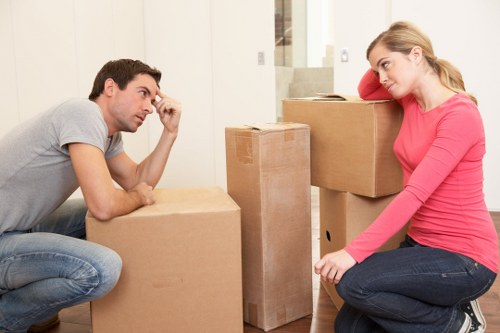 Local office relocation team handling furniture in a Belsizepark building