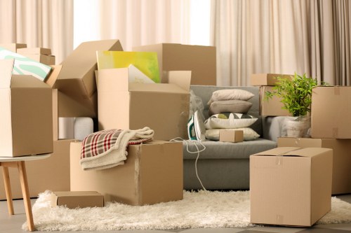House movers carrying furniture through a Belsize Park apartment building
