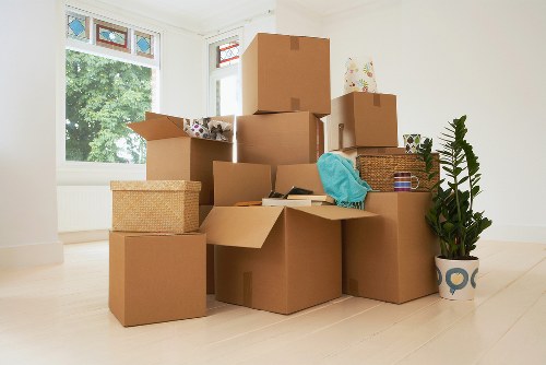 Loading furniture into a moving van on a residential street