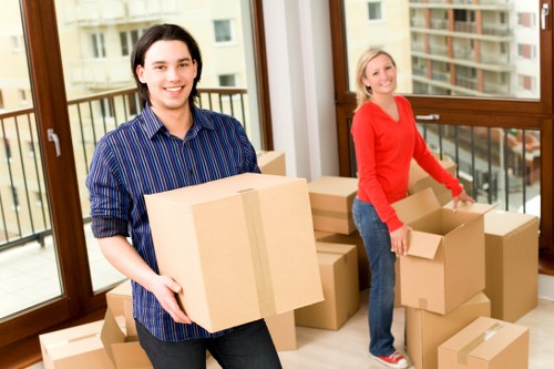 Moving team handling items near residential flats