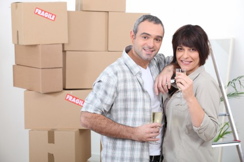 Mover helping with furniture in a Belsizepark flat
